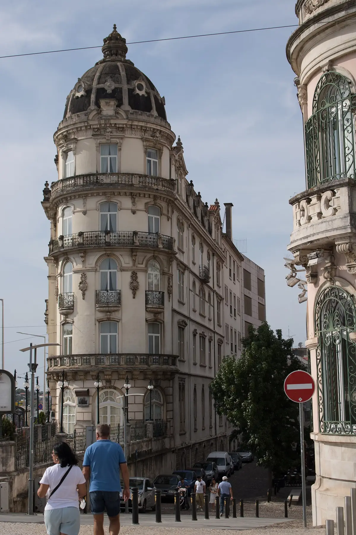 The flat-iron facade of a historic Coimbra hotel on the riverfront avenue