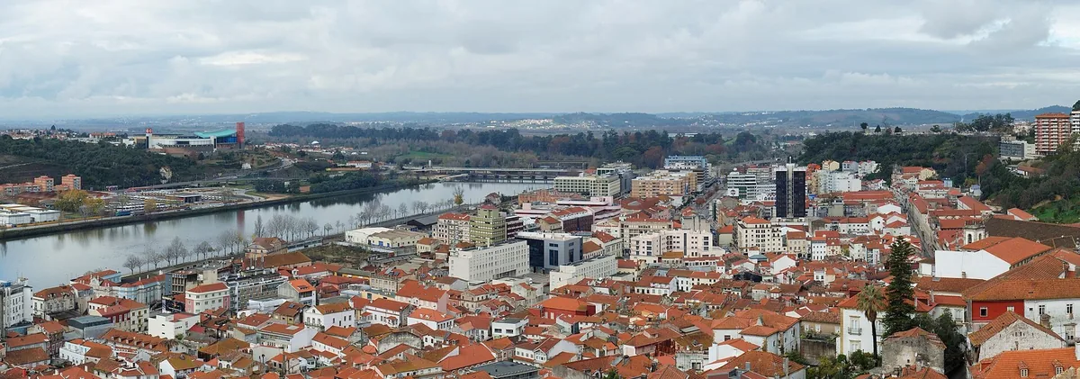 Evening light on the Mondego river and the Coimbra university hill