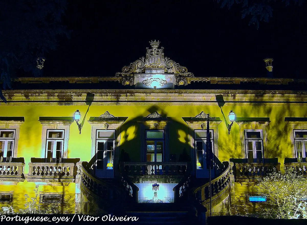 The 18th-century palace facade of Hotel Quinta das L&aacute;grimas floodlit at night