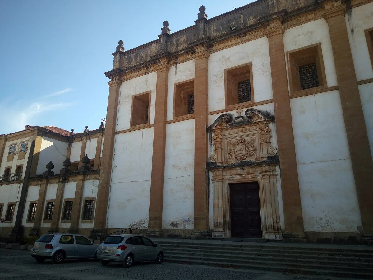 The long baroque facade of the Mosteiro de Santa Clara-a-Nova above Coimbra
