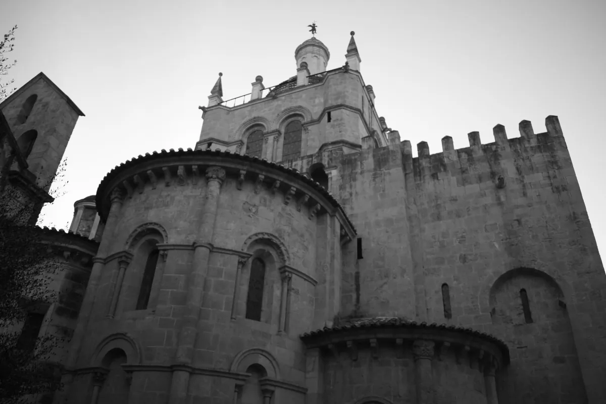 The S&eacute; Velha, Coimbra&rsquo;s fortified Romanesque old cathedral, seen from the stepped lane below it